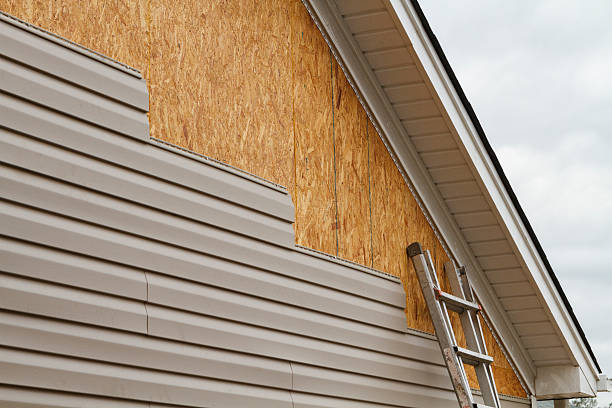 Professional Storm Damage Siding Repair technician working in Weston, MA